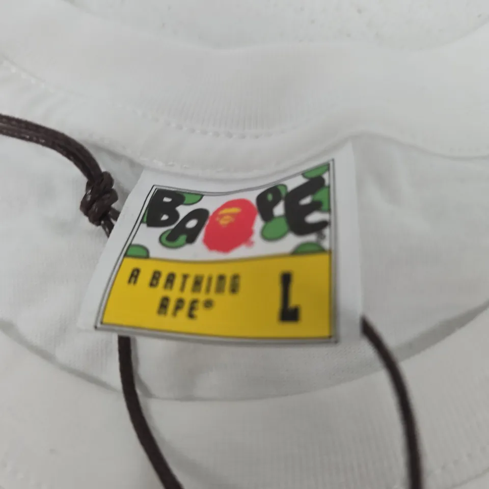A BATHING APE T-SHIRT – WHITE, CAMOUFLAGE APE LOGO, SIZE L (UK)