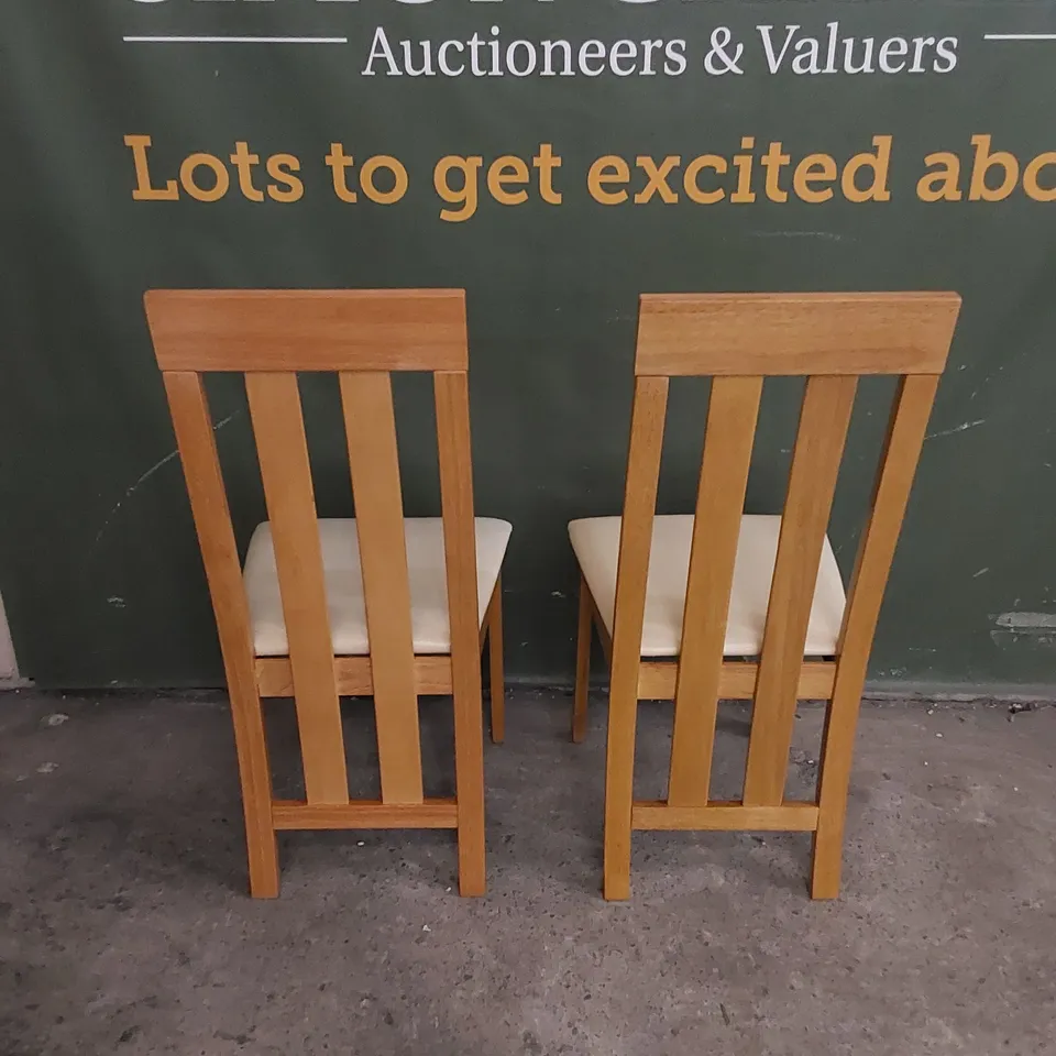 SET OF 2 CHESTER OAK DINING CHAIRS WITH IVORY LEATHER SEAT PADS 