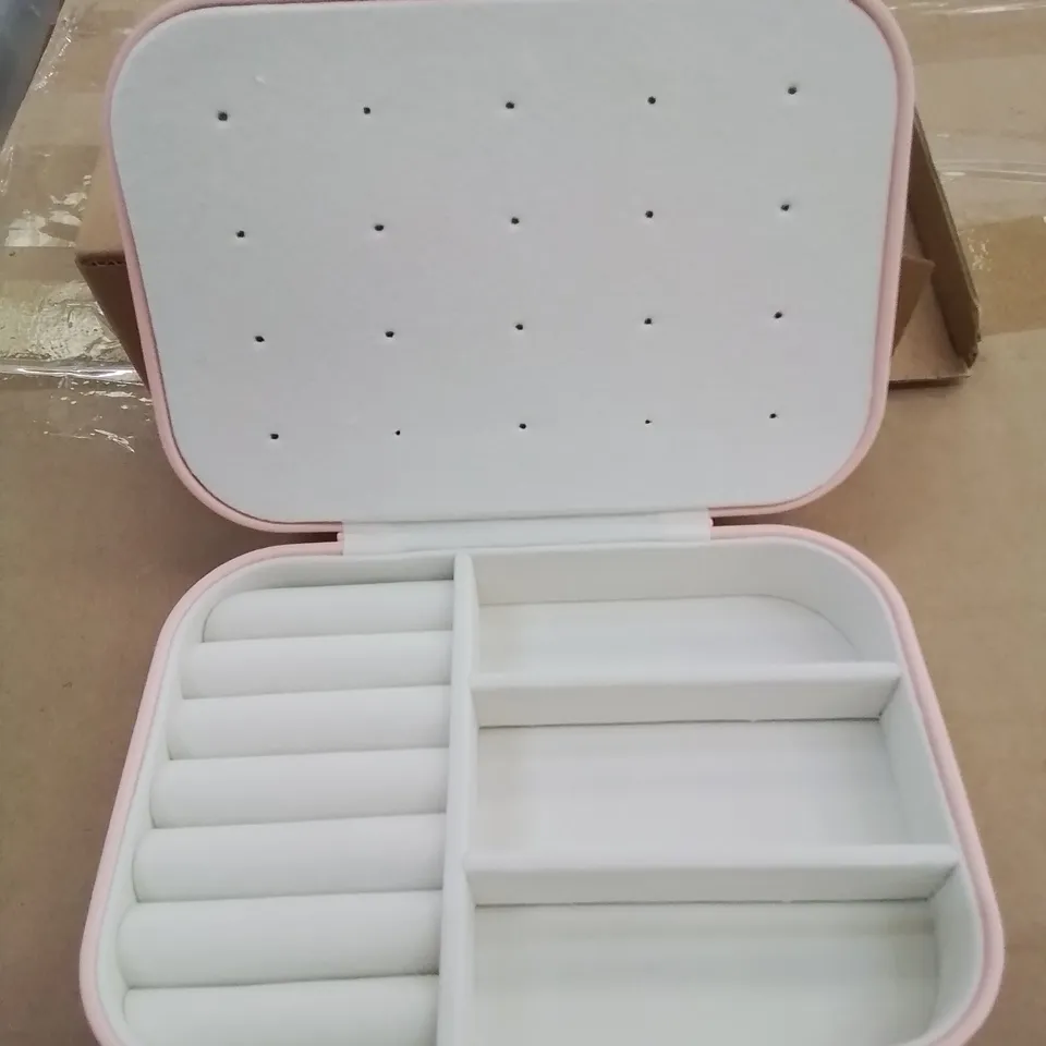 A BOX OF APPROXIMATELY 50 VANITY CASES IN PINK