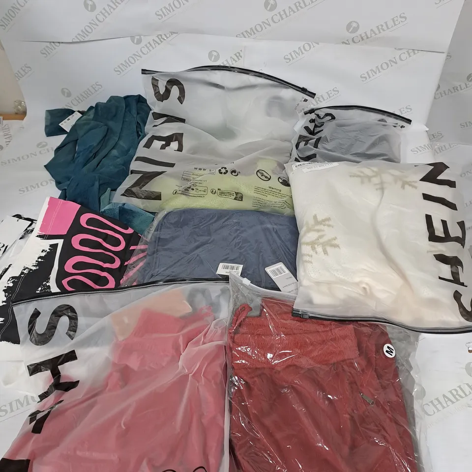 LARGE BOX OF ASSORTED CLOTHING ITEMS IN VARIOUS COLOURS AND SIZES INCLUDING TROUSERS , TOPS AND JUMPERS 