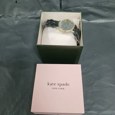 BOXED KATE SPADE NEW YORK LILY AVENUE BLACK LEATHER PLAIT STRAP WATCH IN GOLD