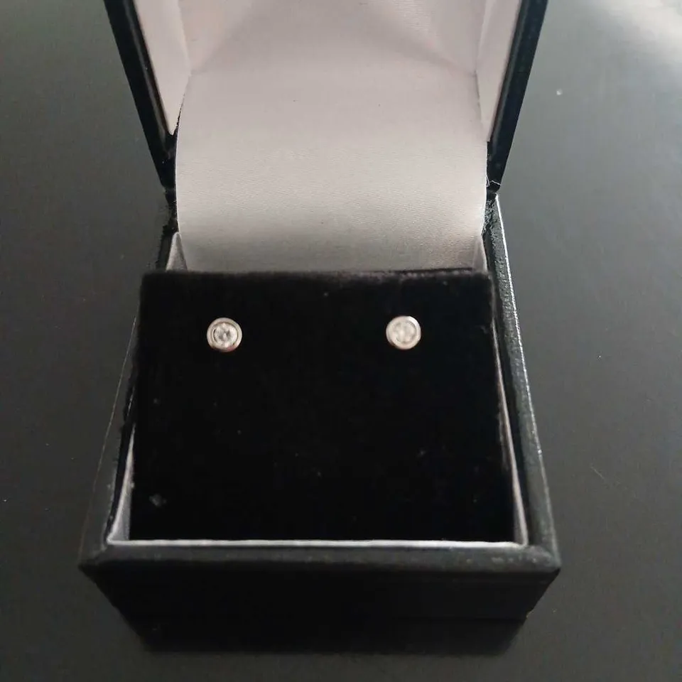 PLATINUM STUD EARRINGS RUBOVER SET WITH NATURAL DIAMONDS