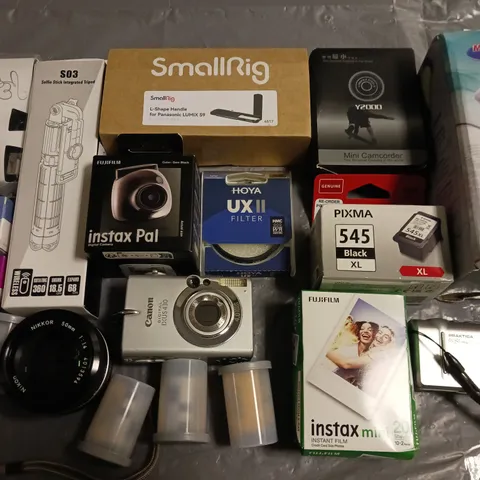 LOT OF APPROXIMATEY 15 ASSORTED CAMERAS AND ACCESSORIES TO INCLUDE FUJIFILM INSTAX MINI, SELFIE STICK TRIPOD AND CANON CAMERA