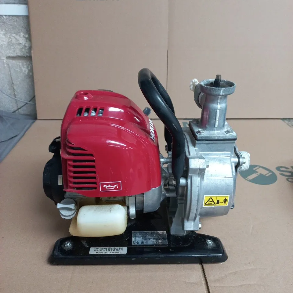 HONDA WX10 1-INCH PETROL-POWERED WATER PUMP DESIGNED FOR AGRICULTURAL, GARDEN, OR DOMESTIC WATER TRANSFER.