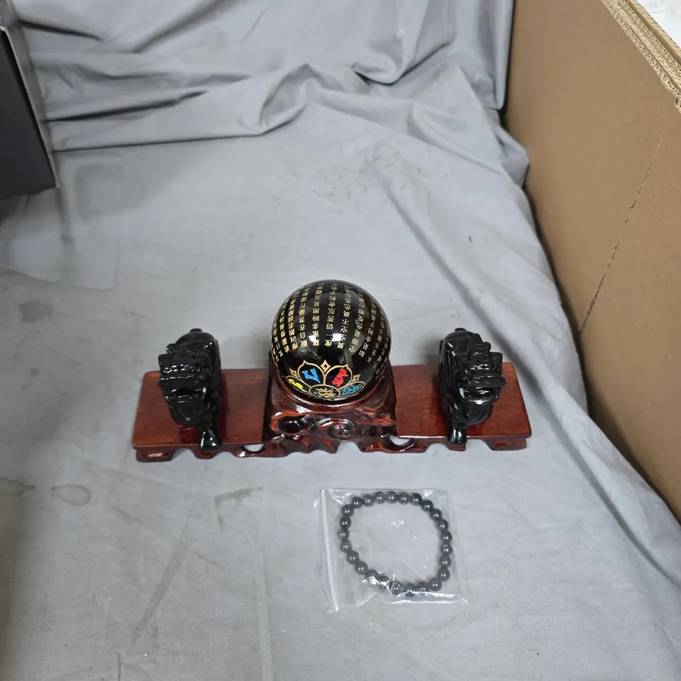 CHINESE CARVED WOODEN DISPLAY SET WITH LACQUERED ORB AND GUARDIAN LIONS, IN PINK PRESENTATION BOX