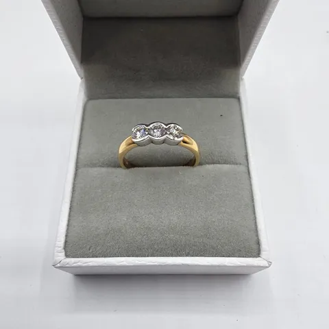 18CT GOLD THREE STONE RING RUB-OVER SET WITH NATURAL DIAMONDS
