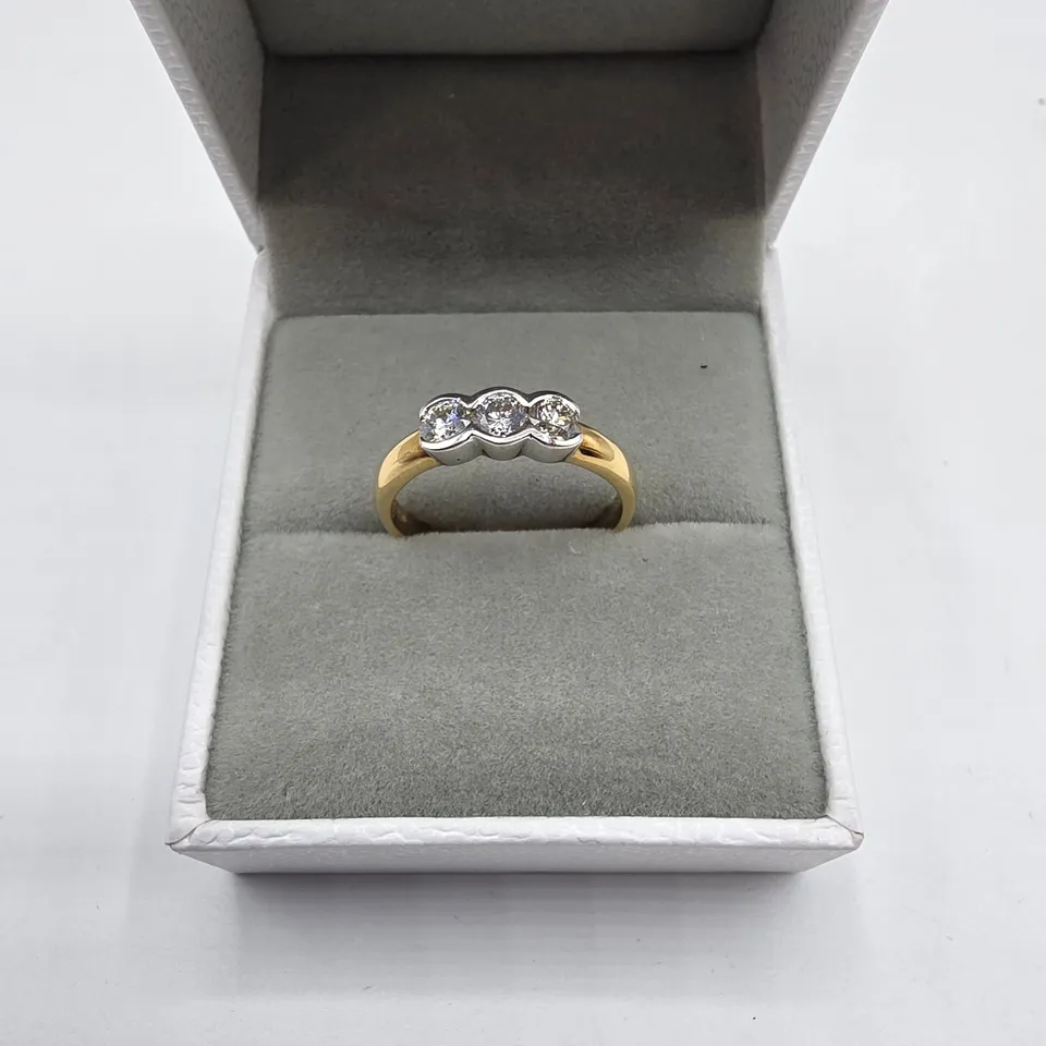 18CT GOLD THREE STONE RING RUB-OVER SET WITH NATURAL DIAMONDS