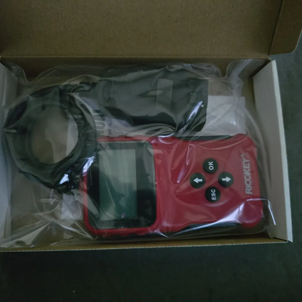 Red handheld electronic device with display and 4-way navigation pad 