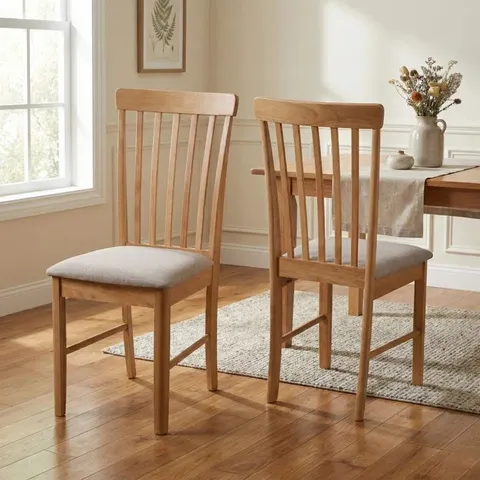 BOXED PAIR OF ANKRUM FARAH SOLID WOOD DINING CHAIRS - LIGHT OAK EFFECT