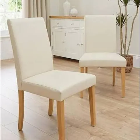 BOXED PRIMO PAIR OF FAUX LEATHER DINING CHAIRS - CREAM/OAK (1 BOX)
