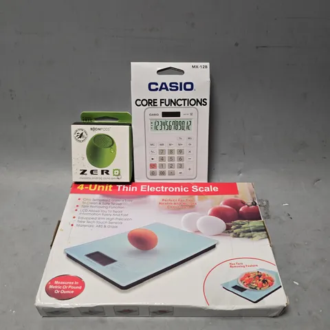 APPROXIMATELY 4 ASSORTED ITEMS TO INCLUDE - CASIO CALCULATOR , THIN ELECTRONIC SCALE , BOOMPODS ZERO SPEAKER ETC