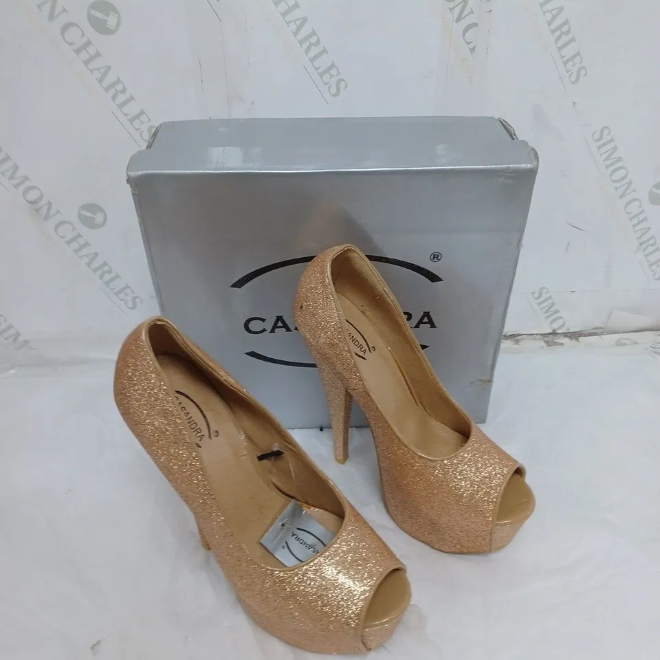 LARGE BOX OF BOXED APPROXIMATELY 10 CASSANDRA OPEN TOE HEELS IN GOLD GLITTER IN VARIOUS SIZES