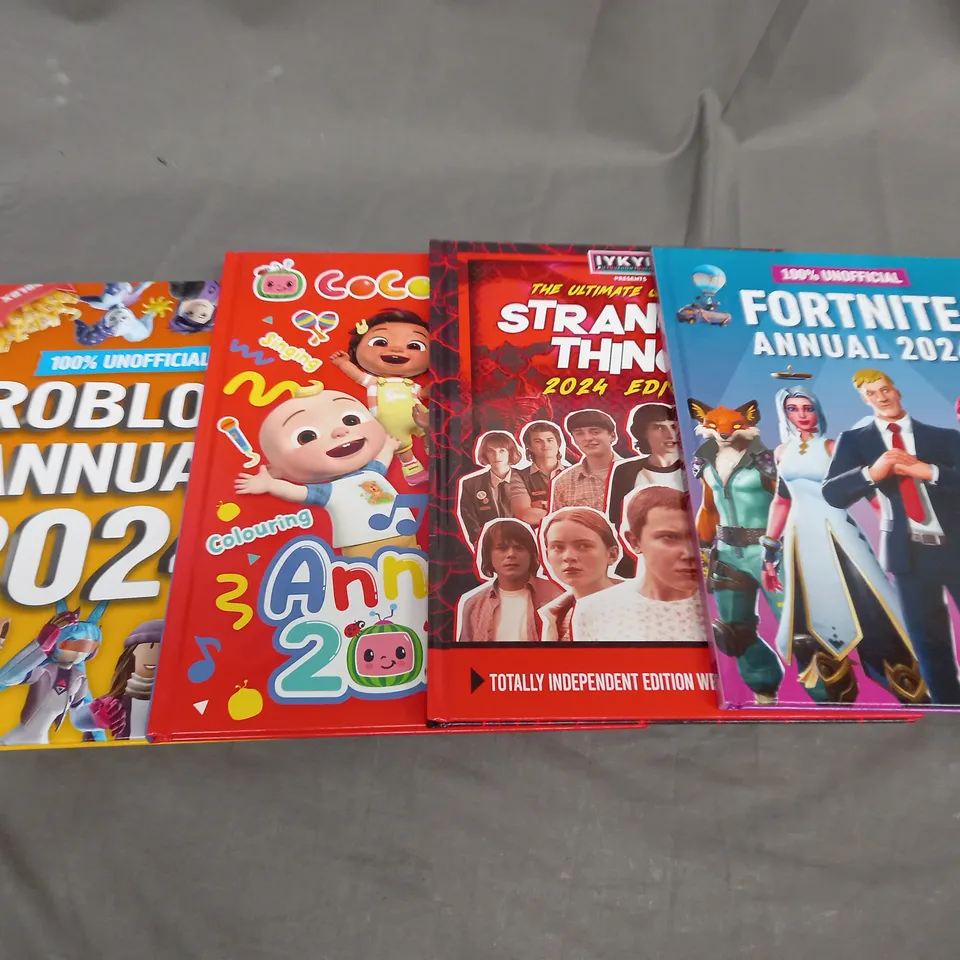 BOX OF APPROXIMATEL 10 ASSORTED BOOKS AND TOYS TO INCLUDE STRANGER,ROBLOX AND FORTNITE