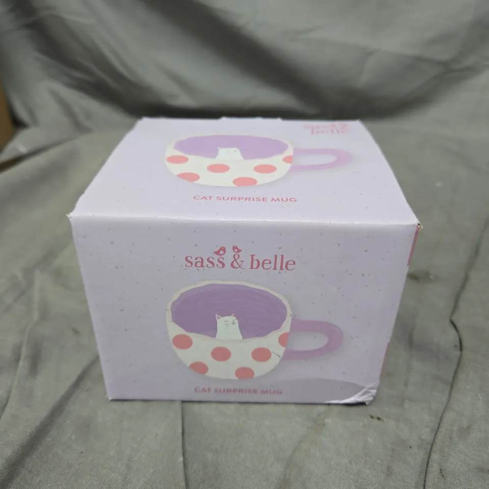SASS & BELLE CAT SURPRISE MUG – LILAC INTERIOR, WHITE WITH PINK POLKA DOTS, CAT FIGURINE INSIDE