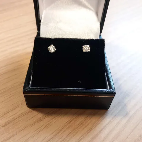 PLATINUM STUD EARRINGS SET WITH NATURAL DIAMONDS 