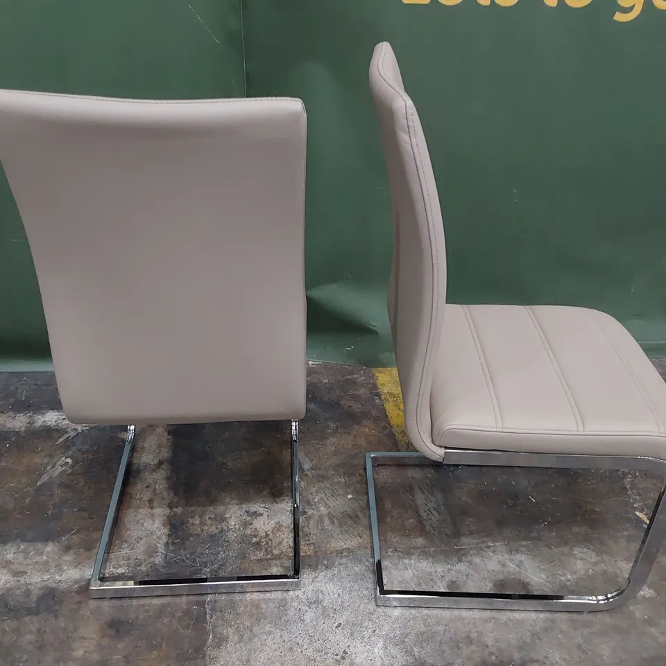 PAIR UPHOLSTERED DINING CHAIRS FAWN PU ON CHROME FRAMES 