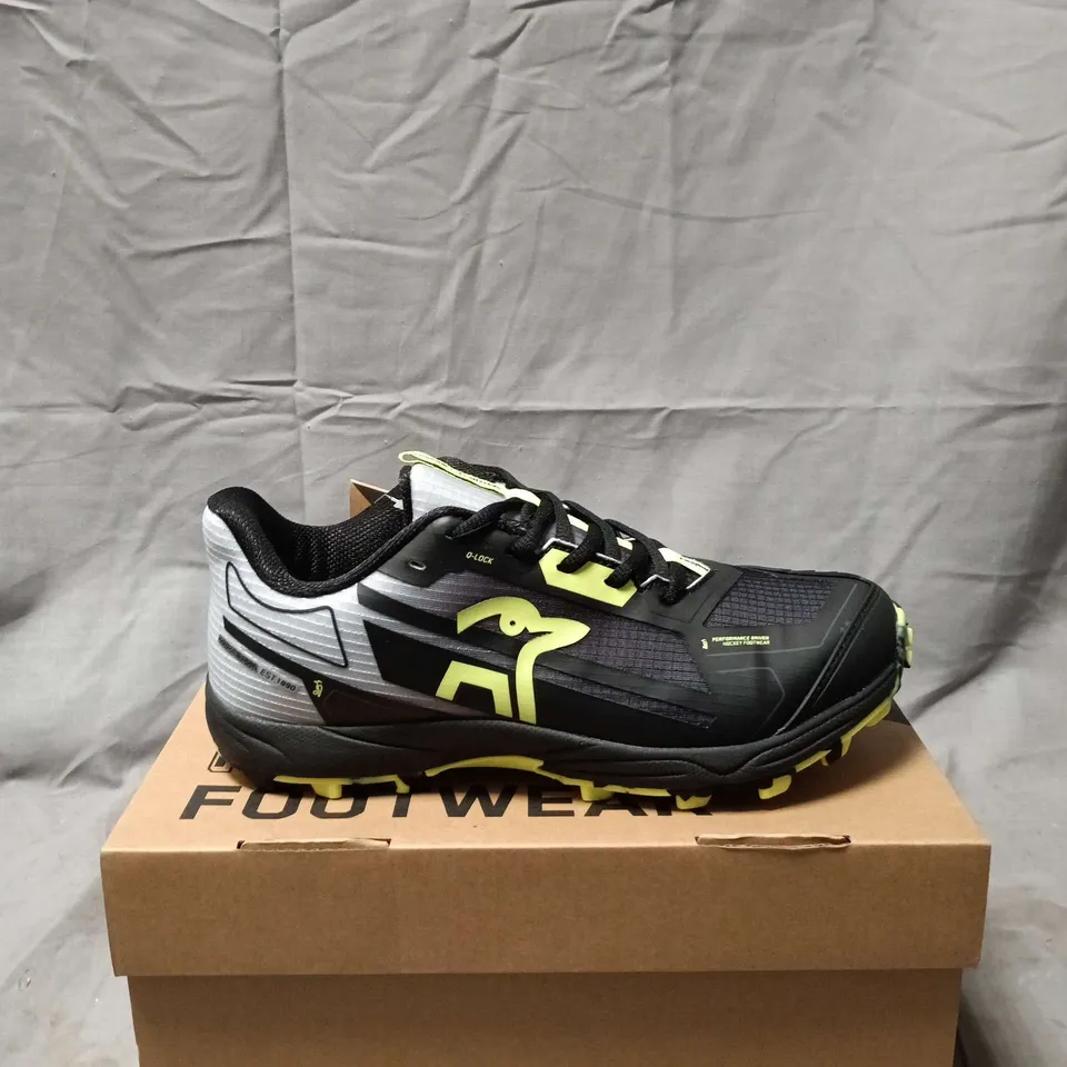 BOXED PAIR OF  KOOKABURRA ROGUE JUNIOR HOCKEY SHOES – BLACK/YELLOW, UK 4 (EU 37)