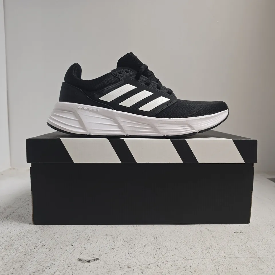 BOXED PAIR OF ADIDAS GALAXY 6 TRAINERS IN BLACK/WHITE SIZE UK 9