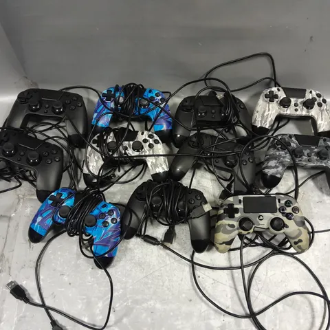 APPROXIMATELY 11 ASSORTED WIRED GAMING CONTROLLERS IN VARIOUS COLOURS AND DESIGNS