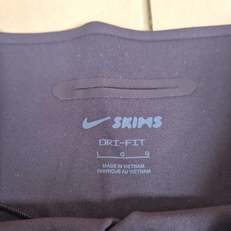 NIKE SKINS DRI-FIT LEGGINGS - PURPLE - WOMEN'S L