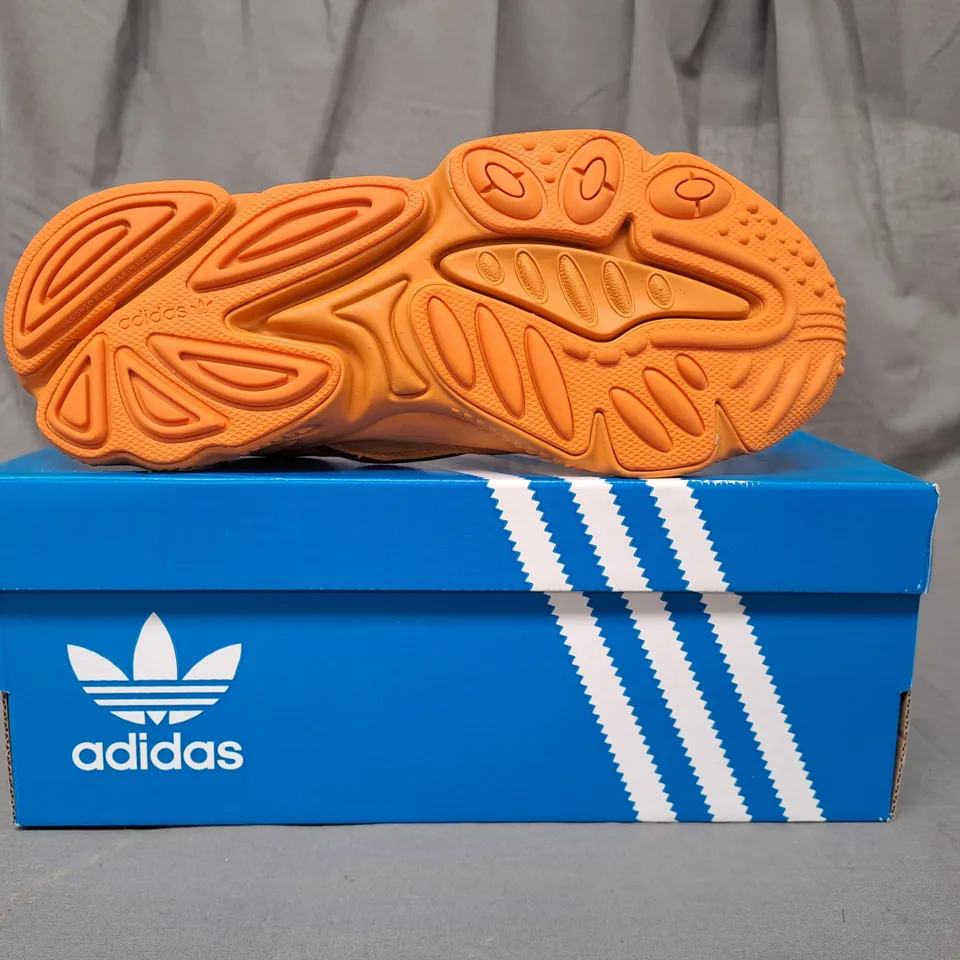 BOXED PAIR OF ADIDAS OZWEEGO SHOES IN ORANGE UK SIZE 6