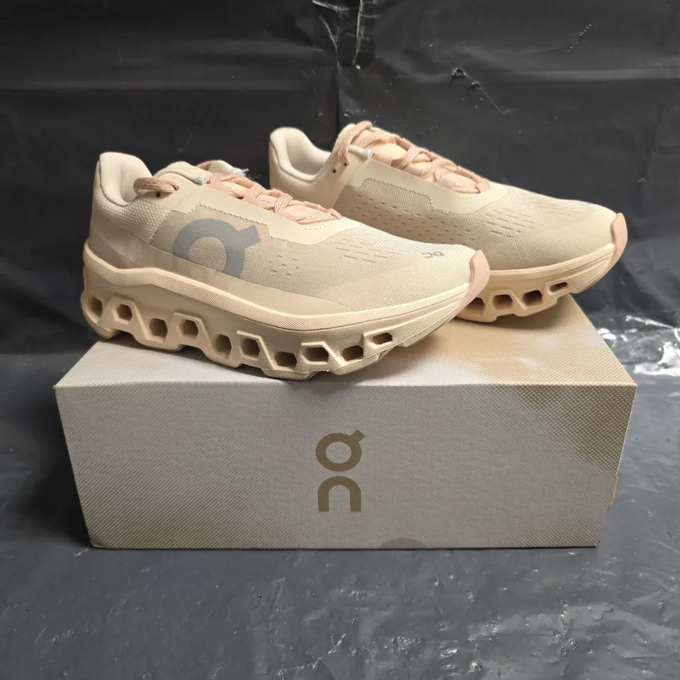 BOXED PAIR OF ON CLOUDMONSTER TRAINERS IN MOON/FAWN SIZE UK 5