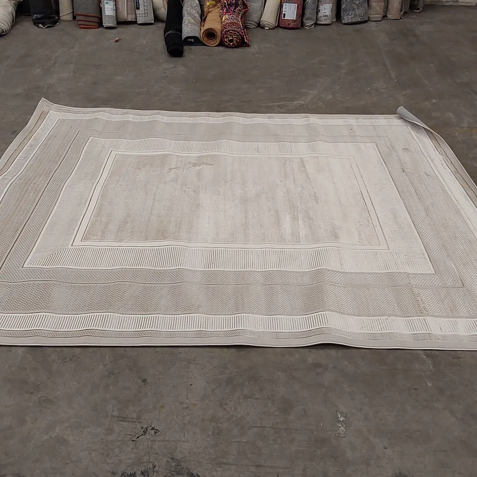 ABYE MACHINE WOVEN RUG IN IVORY - 239 x 300cm