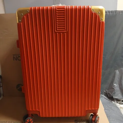 RED HARD-SHELL SUITCASE WITH GOLD-TONE CORNERS; LINING WITH HEART PATTERN. WITH SIDE CARRY HANDLE OPTION