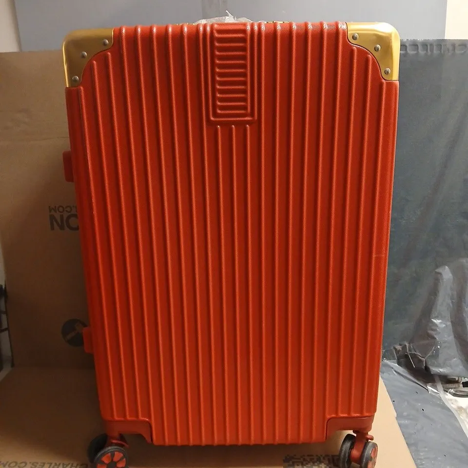 RED HARD-SHELL SUITCASE WITH GOLD-TONE CORNERS; LINING WITH HEART PATTERN. WITH SIDE CARRY HANDLE OPTION