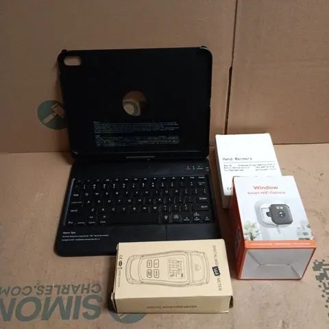 TOTE OF APPROXIMATELY 12 ASSORTED ITEMS TO INCLUDE KEYBOARD CASE, HAND WARMERS, SMART WIFI CAMERA, DIGITAL THERMOMETER ETC