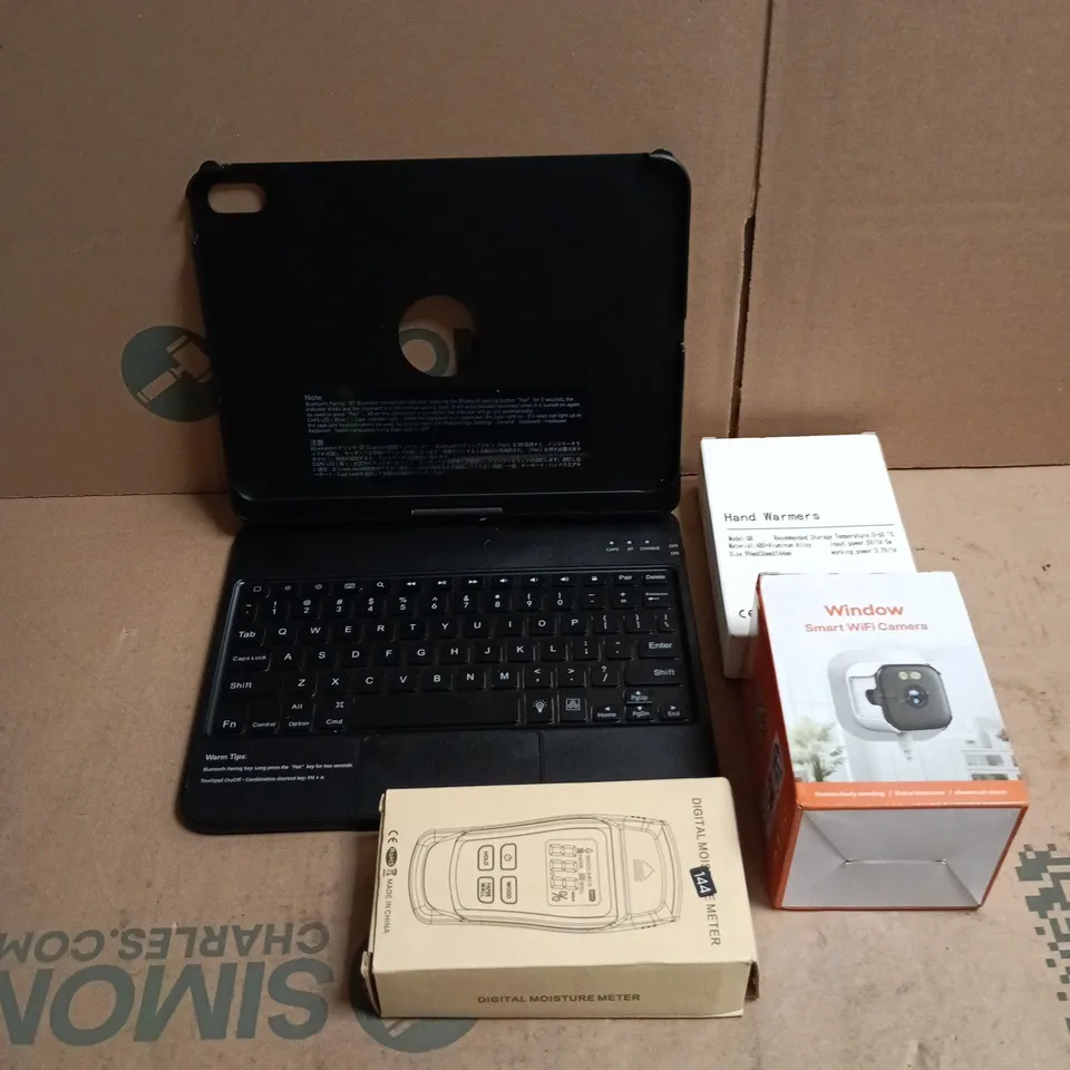 TOTE OF APPROXIMATELY 12 ASSORTED ITEMS TO INCLUDE KEYBOARD CASE, HAND WARMERS, SMART WIFI CAMERA, DIGITAL THERMOMETER ETC