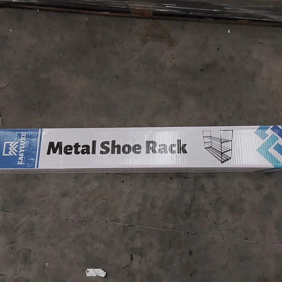 PALLET TO CONTAIN ASSORTED HOUSEHOLD ITEMS AND CONSUMER PRODUCTS. INCLUDES A LARGE QUANTITY OF METAL SHOE RACKS AND BOXED FURNITURE ETC