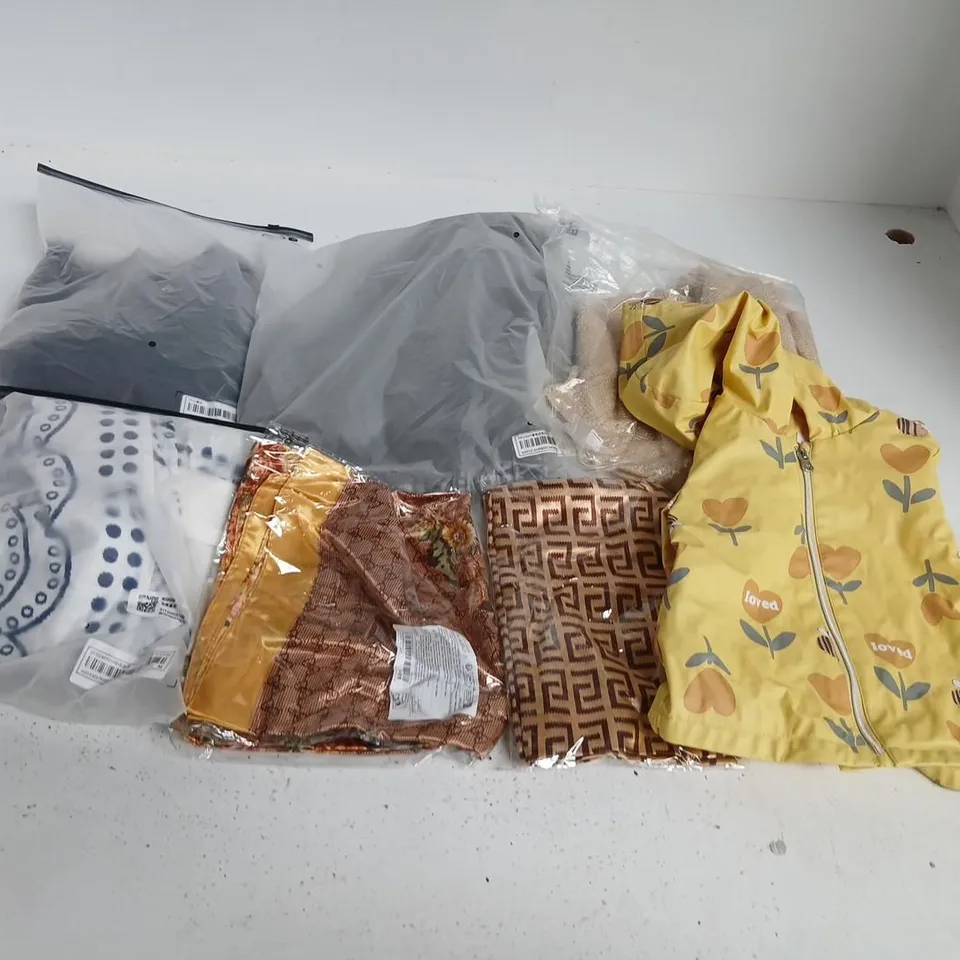 LARGE QUANTITY OF ASSORTED CLOTHING AND ACCESSORIES TO INCLUDE; PANTS, RAIN COAT AND SLIPPERS