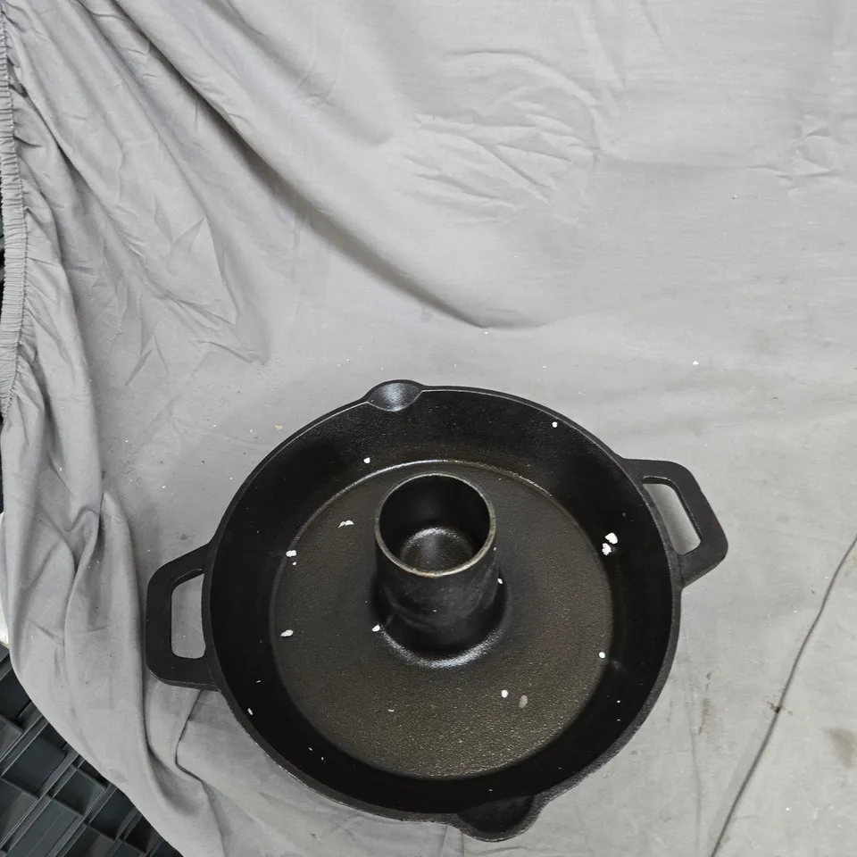 CAST IRON ROUND COOKING POT WITH CENTRAL CHIMNEY AND SIDE HANDLES