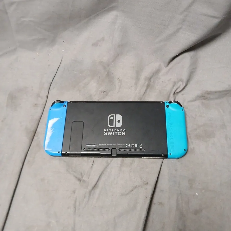 NINTENDO SWITCH CONSOLE WITH NEON BLUE JOY-CON CONTROLLERS