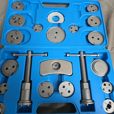 Blue plastic tool case with metal dies and puller components – multi‑die puller set