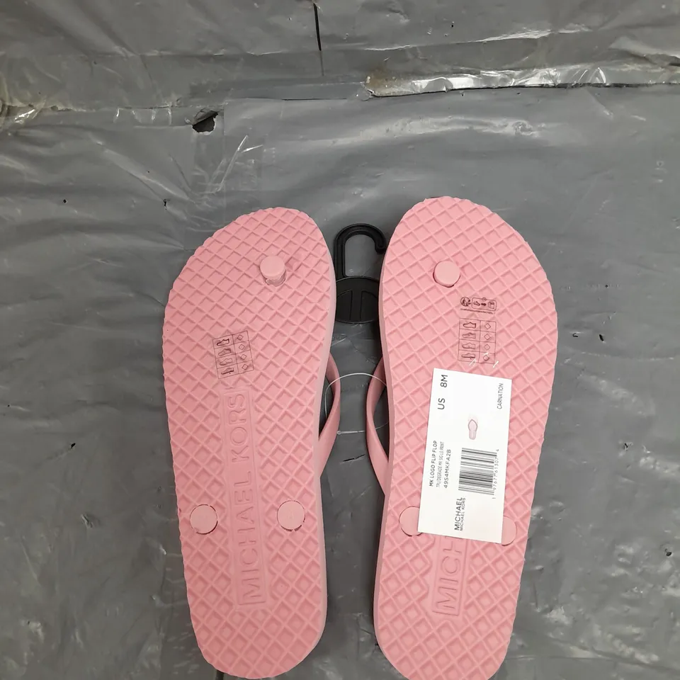 UNBOXED PAIR OF MICHAEL KORS LOGO FLIP FLOP IN PINK US MEANS 8 