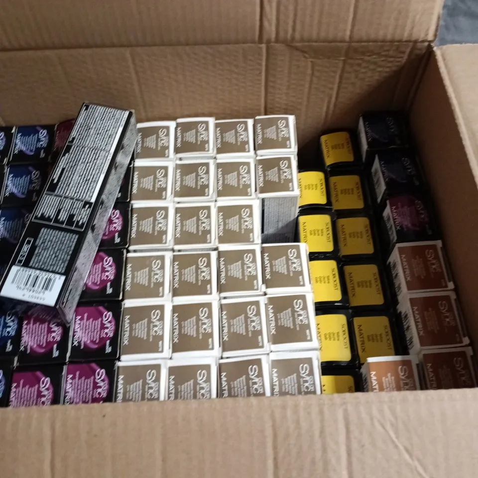 BOX OF APPROXIMATELY 68 HAIR CARE PRODUCTS INCLUDING MATRIX SOBOOST AND MATRIX COLOR SYNC BRUNETTE YELLOW MAGENTA PURPLE