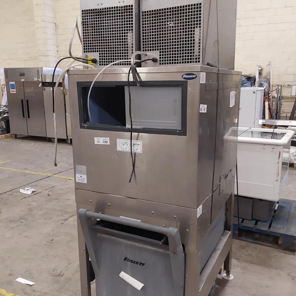 FOLLETT COMMERCIAL ICE MACHINE ON STAND WITH ICE TROLLEY