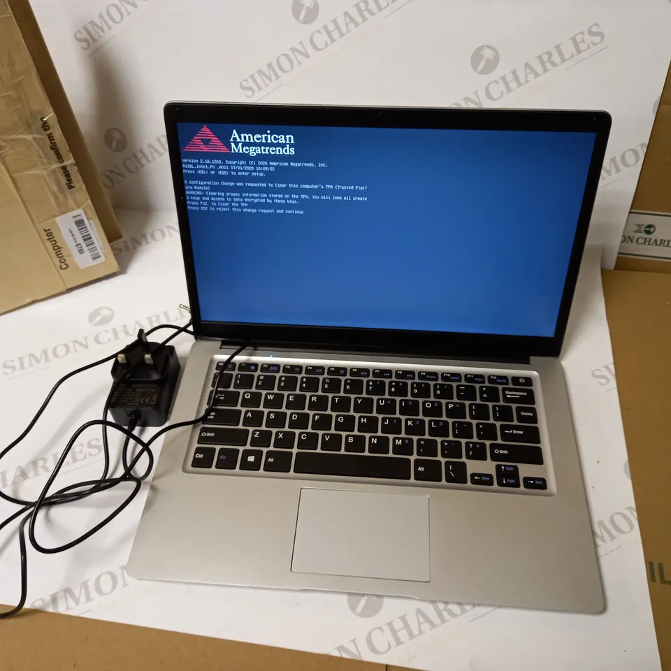 UNBRANDED SILVER LAPTOP WITH POWER LEAD APPROX. 15" SCREEN