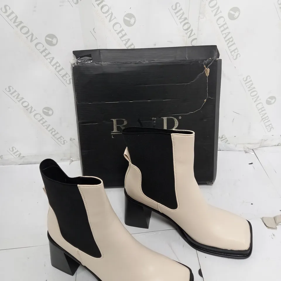 BOXED PAIR OF SLIP ON BLOCK HEEL BOOTS CREAM SIZE UK 6 