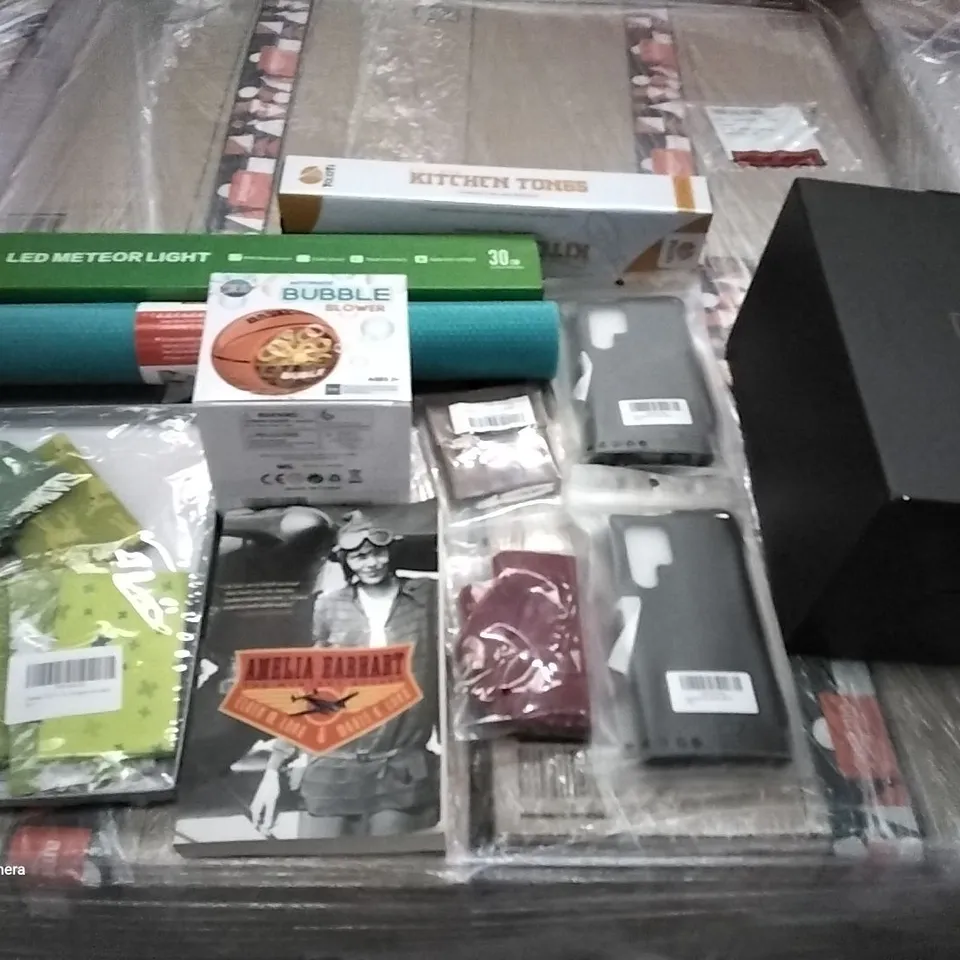 PALLET OF ASSORTED ITEMS INCLUDING AMELIA EARHART BOOK, AUTOMATIC BUBBLE BLOWER, PHONE CASES, KITCHEN TONGS, LED METEOR LIGHTS, PROTECTIVE MAT