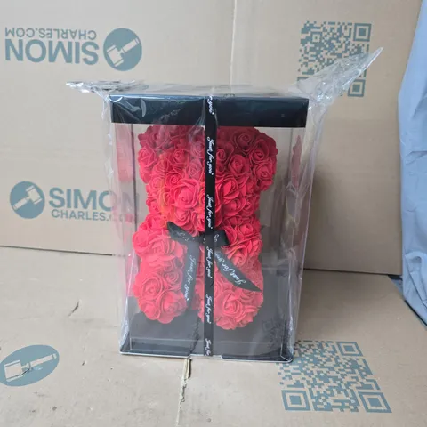 BOX OF APPROXIMATELY 12 BEAR ARTIFICIAL RED ROSE BOUQUET IN CLEAR PRESENTATION BOX WITH RIBBON