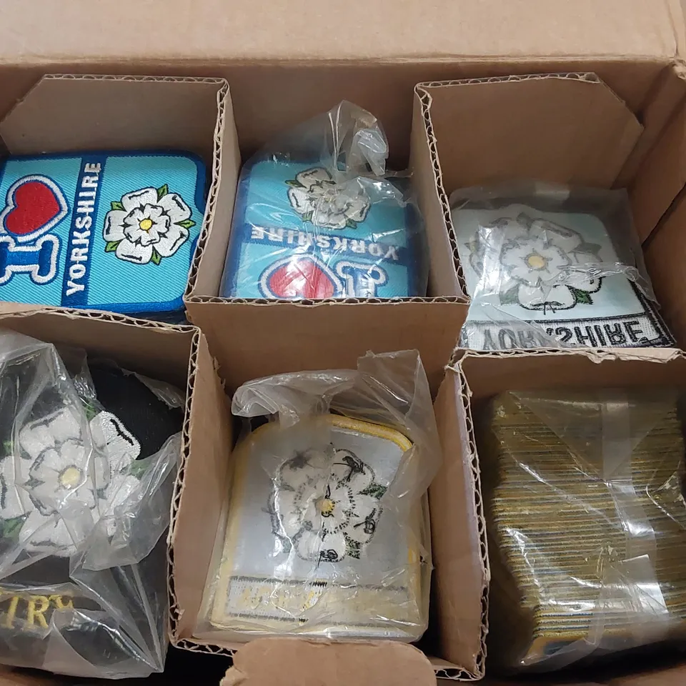 BOX CONTAINING A LARGE ASSORTMENT OF YORKSHIRE EMBROIDERED PATCHES