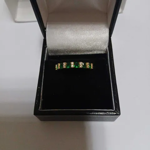YELLOW GOLD RING WITH ALTERNATING GREEN AND CLEAR STONES STERLING SILVER