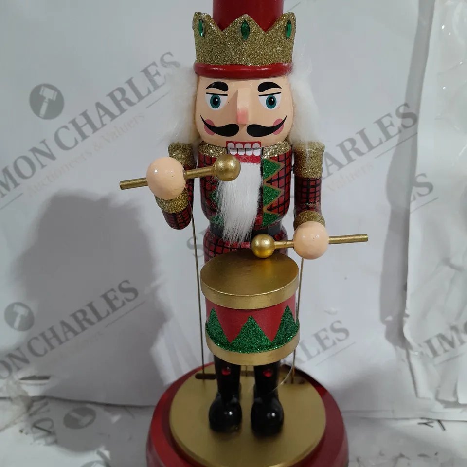 FESTIVE 32CM WOODEN ANIMATED MUSICAL NUTCRACKER