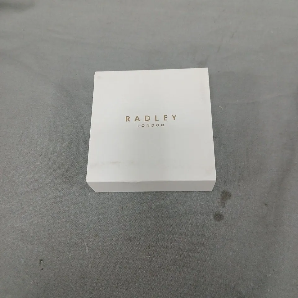 RADLEY LONDON 18CT GOLD PLATED EARRING AND MIX CHARM SET. ONE CHARM MISSING