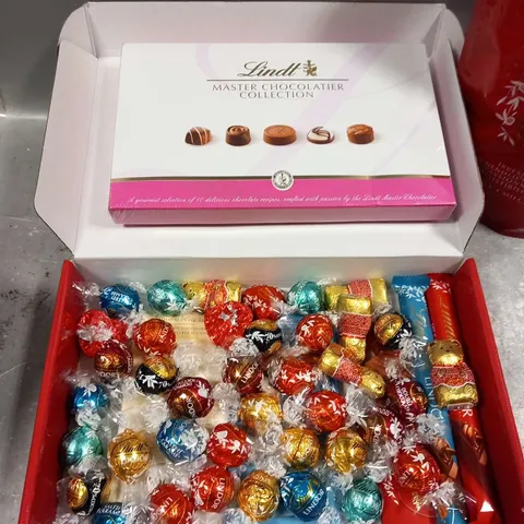 THREE ASSORTED LINDT PRODUCTS TO INCLUDE;LINDOR 1KG 78 TRUFFLE BAG,MASTER CHOCOLATIER COLLECTION 184G AND ASSORTED CHCOLATE 851G