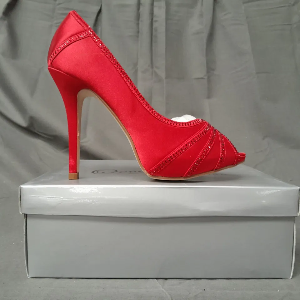 BOX OF APPROXIMATELY 10 BOXED PAIRS OF OCCASIONS BY CASANDRA PEEP TOE HIGH HEEL SHOES IN RED SATIN W. JEWEL EFFECT - VARIOUS SIZES