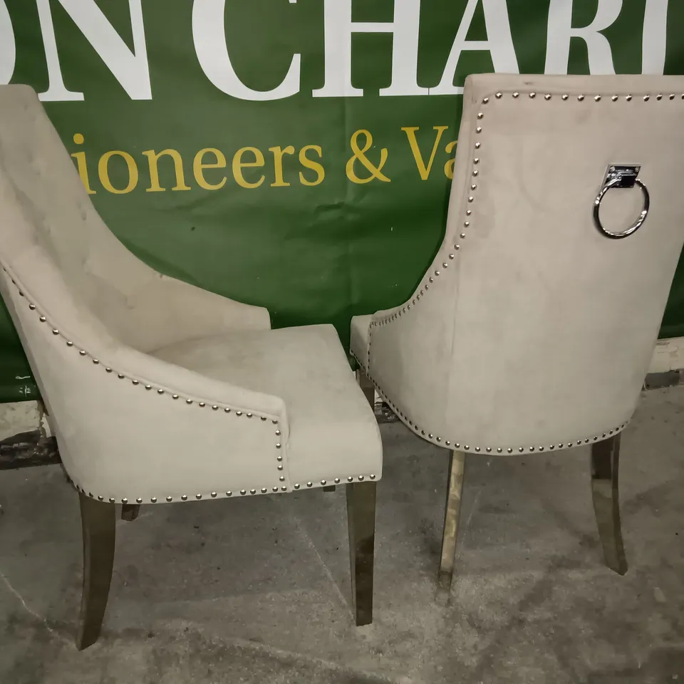 PAIR OF BEIGE FABRIC UPHOLSTERED DINING CHAIRS ON CHROME LEGS WITH STUD DETAILS